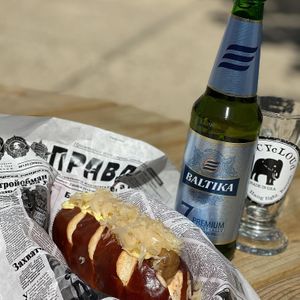 Vegan sausage with sauerkraut with in-house made sauce served on vegan pretzel bun. Paired with Baltika 7, Russian Lager. at sPACYcLOUd Lounge in Washington
