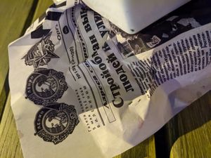 Cyrillic paper for the fish n chips at sPACYcLOUd Lounge in Washington