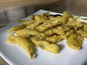 Battered fried banana flower served with BBQ sauce  at Matey Hut in Ella