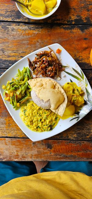 Beans- (left), eggplant- (top) and potato (right) curry and dal (bottom) at Matey Hut in Ella