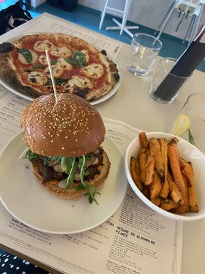 vegan burger with the beyond patty, sweet potato fries and pizza margherita with vegan mozzarella  at Trappa in Ljubljana