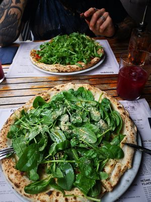 Pesto and spinach pizza and homemade kombucha❤️ at Trappa in Ljubljana