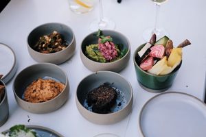 Sharing small dips at apero time at Camion in Antwerpen