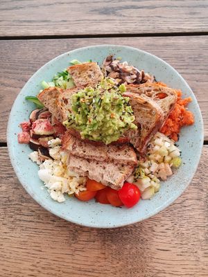 Salad topped with avocado toast at Carbon Fresh in London