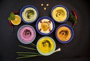 The hummus family : original ,sweet potato & turmeric,pumpkin & cumin,thai basil,thai curry,beetroot & mint ! at Hummus Heads in Bangkok