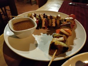 Tofu skewers and satay sauce at Laguna Lodge & Zotz Restaurant in Santa Cruz La Laguna