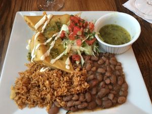 Tamales made in the corn husk with aceite rice and pinto beans.  Dinner entree. at Ravens' Restaurant in Mendocino