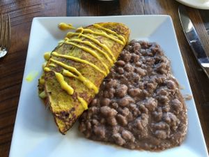 Garbanzo bean savory crepe stuffed with sautéed veggies with pinto beans and cashew cream. Breakfast entree, which comes No Charge when you are a guest of the inn. at Ravens' Restaurant in Mendocino
