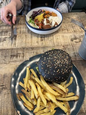 front: Vegan Bad Boy Burger with homemade fries, back: Buddha Bowl  at La Popote D'Ondine in Nice