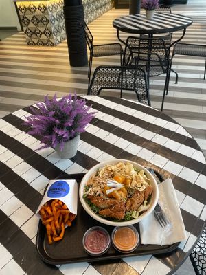 Fries and chiky salad at Beatnic - Seaport District in New York City
