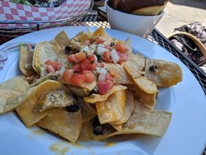 Vegan chicken nachos (minus jalepeños) a little spicy for me but I can't handed my spicy lol it was so yummy. at The Point Pub & Grill in Central Point