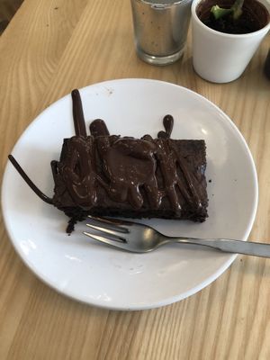 Vegan brownie with a vegan friendly chocolate sauce  at Mrs. Potts Chocolate House in Bristol