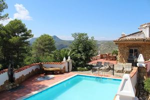 Dip in the salt water pool with mountain views  at Casa Tarsan Vegan Eco Lodge in Villalonga
