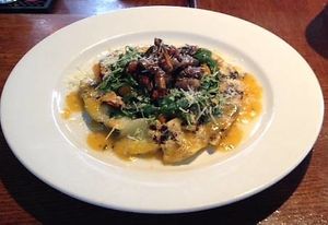 Grilled Squash Salad Arugula: basil & roasted butternut squash tossed in a squash vinaigrette on a bed of grilled zucchini & yellow squashed, topped roasted mushroom sundriedtomato at Lucas Wharf in Bodega Bay