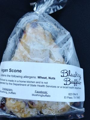 Vegan Cranberry Orange Scone (condensation from being out in the heat). Great texture and delicious. Owner, Gracie, offers samples! at Blushing Buffalo in El Paso