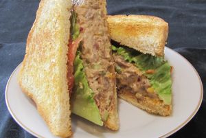 Chicken-less sandwich (jack fruit, onions, celery, orange slices, mango, vegan mayo, spices) on sour dough bread with lettuce and tomato at A Full Taste in Decatur