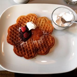Waffles with cream, berries and jam at Täppan Café & Mat in Norrkoping