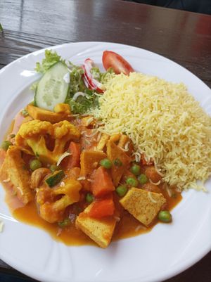Tofu Curry...but with Joghurt on salad, make sure you get vegan food there at Ashirwad in Hamburg