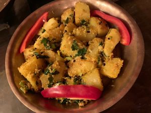 Potatoes with sesame sauce (looks kinda dry but doesn’t feel like it at all - and the spices in this one are SO good)  at YAK + YETI in Vienna
