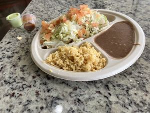 Quesadilla plate with refried beans .  at Veegos in Houston