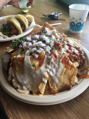 Vegan nachos and tacos. Delicious! at Veegos in Houston