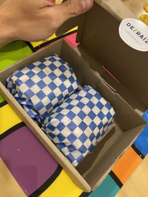 Sandwich comes in a box for delivery  at De/Raiz Cocina Café - Calle 106 in Bogota