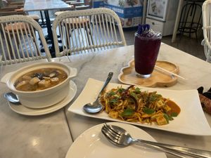 Banana blossom salad, Thai jungle curry and Butterfly pea lemonade.  at Tonklar Facai - Chula in Bangkok