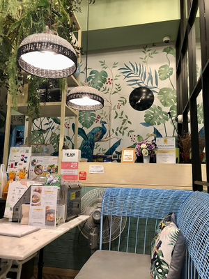 Cool interior with wall paintings of plants at Tonklar Facai - Chula in Bangkok