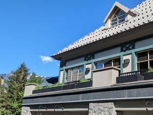 Looking up at the windows that diners look out of at Earls Kitchen + Bar in Whistler