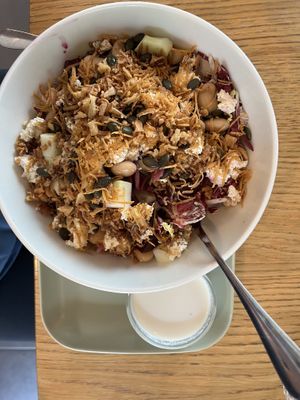 Salad with crispy onions on top  at Veganika in Ljubljana
