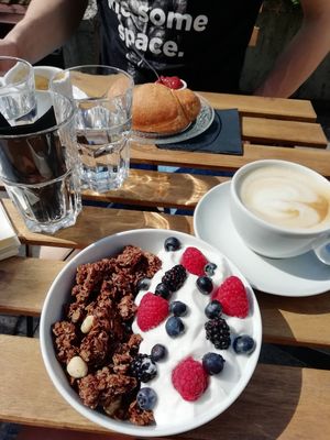 Homemade granola with coconut yogurt and croissant with jam at Veganika in Ljubljana