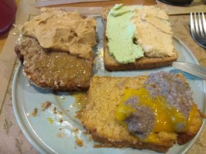 Breakfast buffet example. Bread, banana bread, and different spreads, f.e. Hummus, green tofu paste, Chía pudding. Peanut butter and doce de leite de coco. at Tita Bistro in Rio De Janeiro