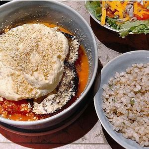 Eggplant and zucchini lasagna with mushrooms and vegan bechamel sauce. Acompanies brown rice and house salad. at Tita Bistro in Rio De Janeiro