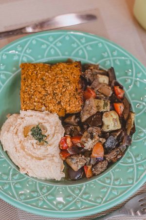 Roasted pumpkin kebab sutffed with caramelized onions, tahine hummus and eggplant and zucchini caponata. at Tita Bistro in Rio De Janeiro