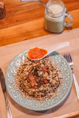 Cauliflower couscous with paris mushroom and toasted sunflower seeds, eggplant and zucchini caponata and rustic tomato sauce. at Tita Bistro in Rio De Janeiro
