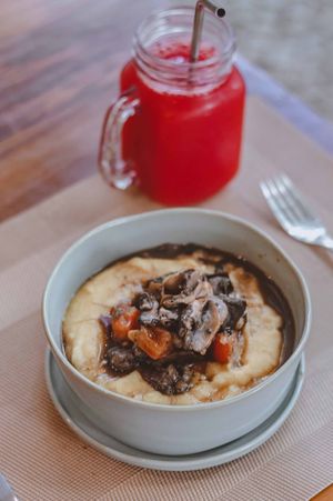 Organic cornmeal polenta with roasted vegetables and mushrooms. at Tita Bistro in Rio De Janeiro