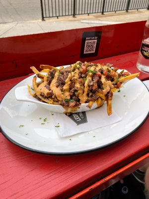 Vegan smash burger poutine — better than expected !  at Leopold's Tavern in Calgary