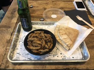 Hummus shawarma with non alcoholic beer.  at Vegan Munch in Birmingham