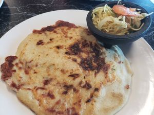 Vegan pupusa stuffed with carrot, spinach, squash, beans and loroco. A side of Salvadoran slaw. at Pupuseria Kent Island in Stevensville