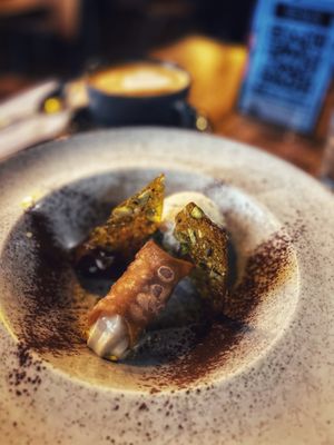 Lemon cannoli with pistachio caramel, chocolate and vanilla ice cream. at Stereo in Glasgow