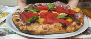 Vegan pizza with vegan ham, tomatoes, purple potato and basil at Frankie's in Sorrento