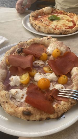 Vegan potato pizza with added vegan meats (husband’s is not vegan in background) and a tasty vegan Greek salad   at Frankie's in Sorrento