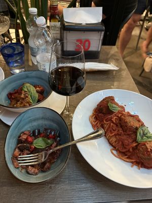 Vegan spaghetti with lentil meatballs + roasted eggplant and peppers on the sidee  at Frankie's in Sorrento