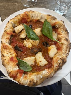 Vegan pizza with eggplant, smoked cheese, lentil sauce, and stuffed with lentil meatballs and ricotta   at Frankie's in Sorrento