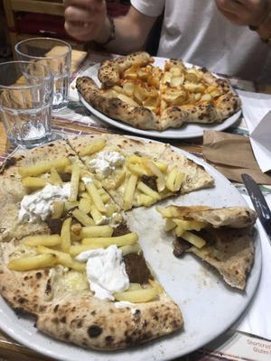 My pizza was the one in the front (the other one isn’t vegan) and it was made by: beyond meat sausage, violife cheese, vegan stracciatella and fries. Delicious . at Frankie's in Sorrento