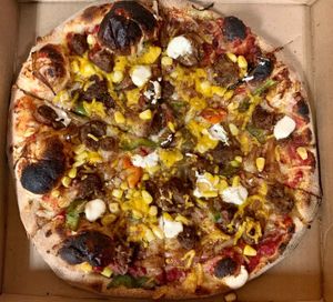 VEGAN SOUTHWEST: Burger bits, onion, green pepper, jalapeño, corn, spices, w. vegan cheddar & sour cream. at Sibie's Pizza in Amherst