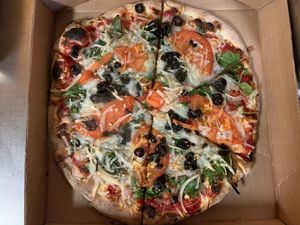 VEGAN MEDITERRANEAN: Freshly picked baby spinach, kalamata olive, onion, garlic, oregano, tomato, with vegan mozzarella & parmesan. at Sibie's Pizza in Amherst