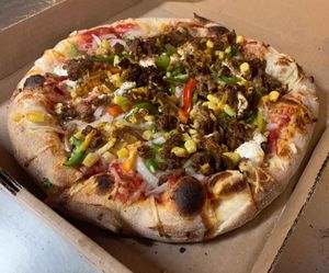 VEGAN SOUTHWEST: Burger bits, onion, green pepper, jalapeño, corn, spices, w. vegan cheddar & sour cream. at Sibie's Pizza in Amherst