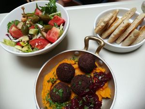 Greek summer forever - fava, beetroot with caramelized onions, keftedes balls, fresh 🥗 and pita at Flow Specialty Coffee Bar & Bistro in Budapest