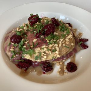 Pancakes with cilantro, cherries and peanuts  at Flow Specialty Coffee Bar & Bistro in Budapest